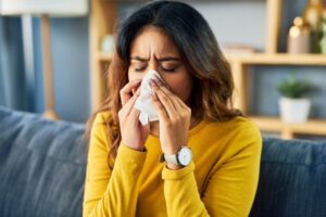 Woman Blowing Nose